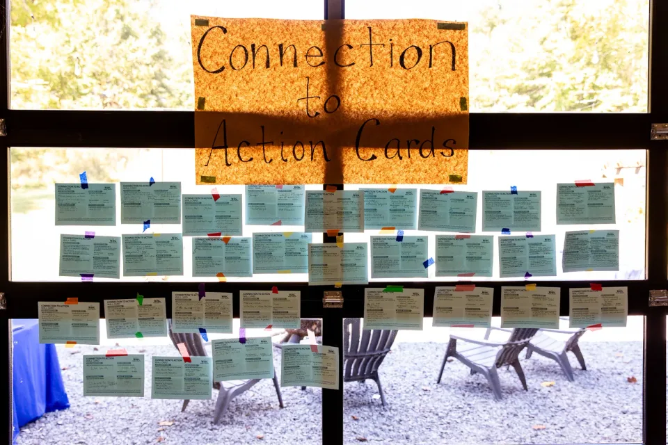 The Connection to Action wall of attendee cards.