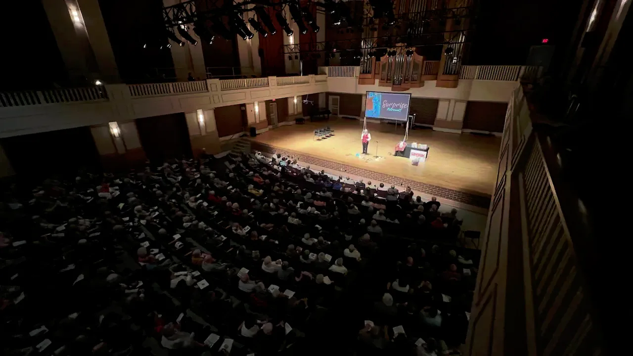 Dr. Ora Wells speaking to a full room at a Brain Health talk.